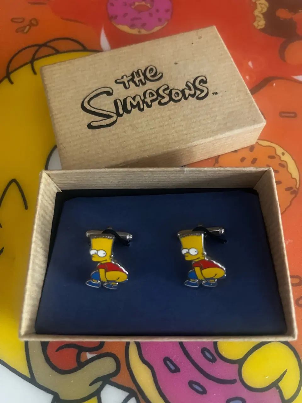 Boutons de manchettes Bart Simpson faisant un «&nbsp;moon&nbsp;»