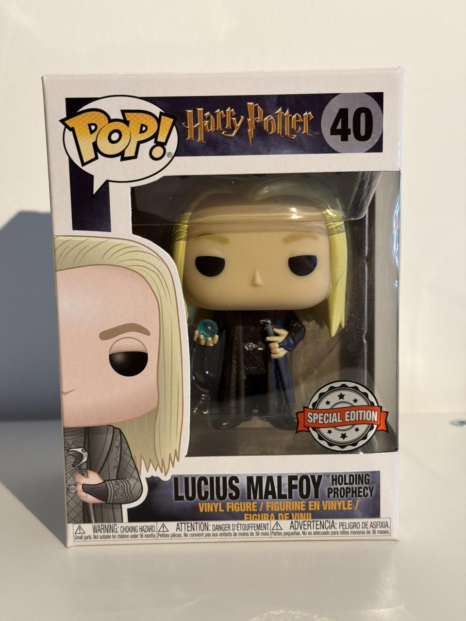 Lucius Malfoy holding prophecy